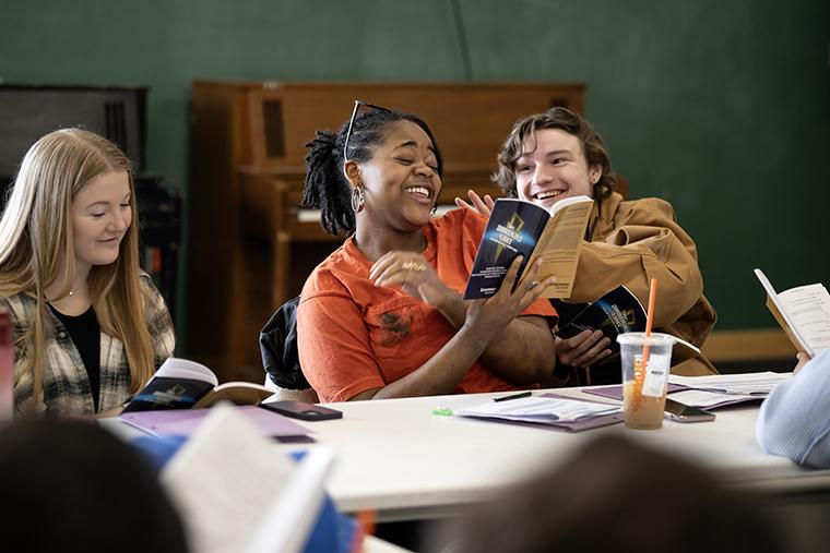 students laugh during a table read